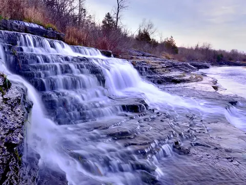 Water pouring over rock ledges on the Black River near Watertown