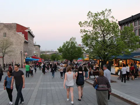 People walking Place Jacques-Cartier in Old Montreal in the evening