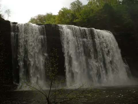 Salmon River Falls pouring over a rock ledge in spring